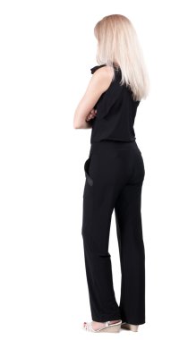 arkadan görünüşü duran genç güzel sarışın kadın.