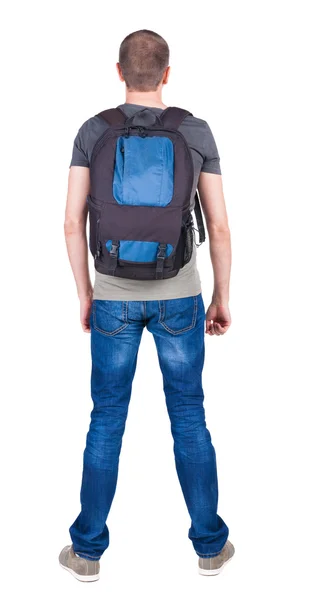 Back view of man with backpack looking up. — Stock Photo, Image