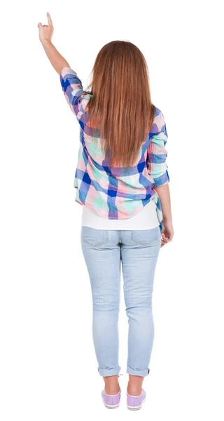 Vista di puntamento donna posteriore. ragazza bella rossa in jeans. — Foto Stock