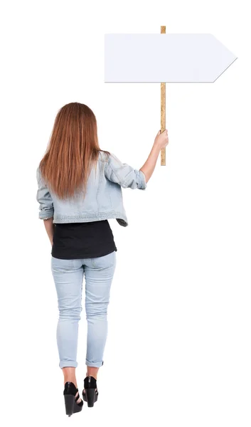 Back view of woman showing a sign board. — Stock Photo, Image