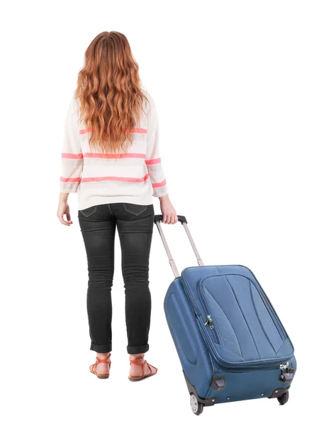 Vue de la femme avec la valise de marche arrière. — Photo