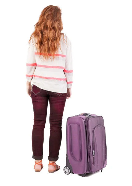 Back view of walking woman with suitcase. — Fotografia de Stock