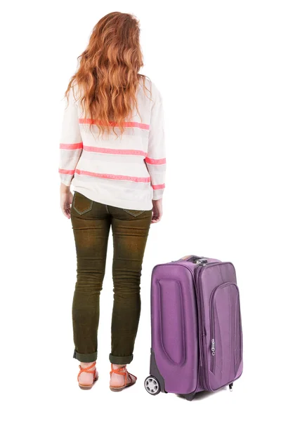 Back view of walking woman with suitcase. — Stock Photo, Image