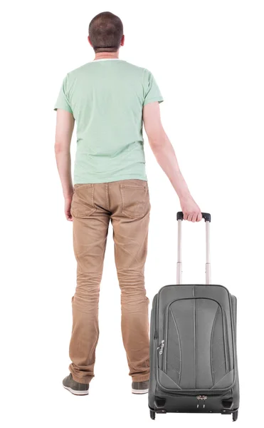 Back view of man with suitcase looking up — Stok Foto