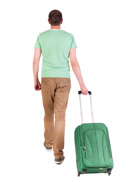 Back view of walking man with suitcase. — Stock Photo, Image