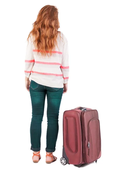Vista posterior de poca mujer con maleta. — Foto de Stock