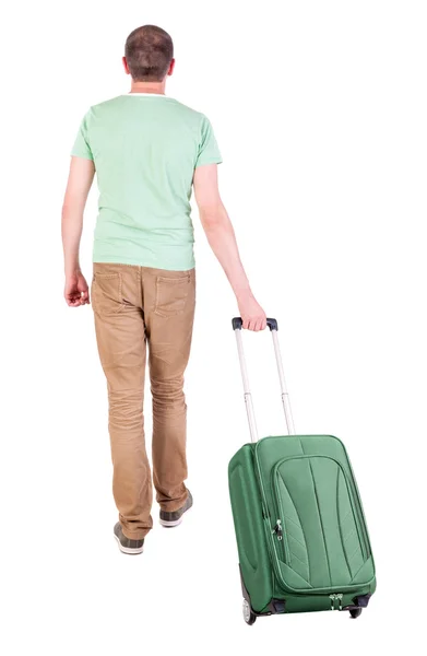 Back view of walking man with suitcase. — Stock Photo, Image