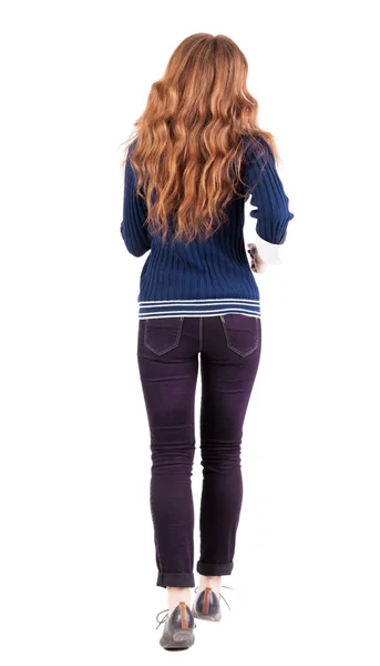 Back view of jumping woman in jeans. — Stock Photo, Image