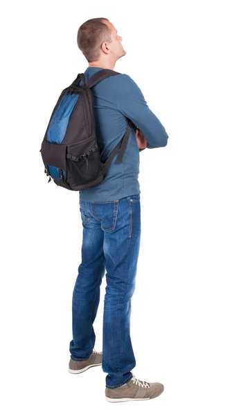 Back view of man with photographic backpack looking up — Stock Photo, Image