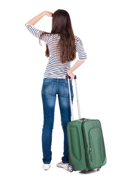 Widok kobiety brunetka z tyłu z walizką patrząc — Zdjęcie stockowe