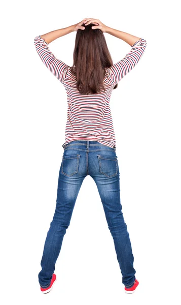 Back view of shocked woman in blue jeans. — Stock Photo, Image