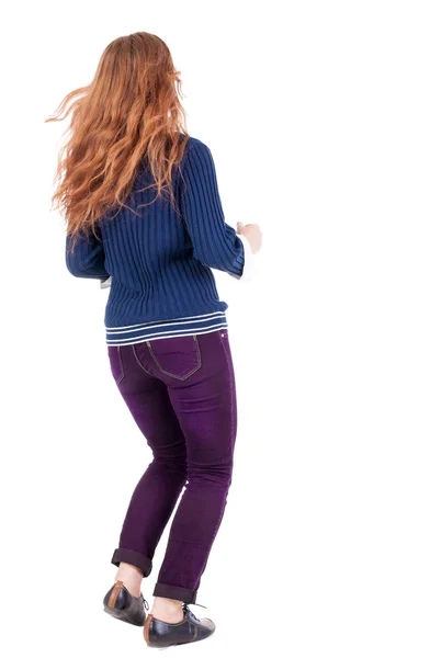 Back view of jumping woman in jeans. — Foto de Stock