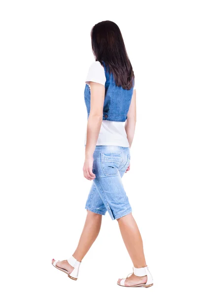 Back view of walking woman in shorts. — Stock Photo, Image