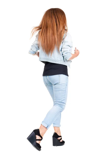 Back view of running woman with flying hair. — Stock Photo, Image