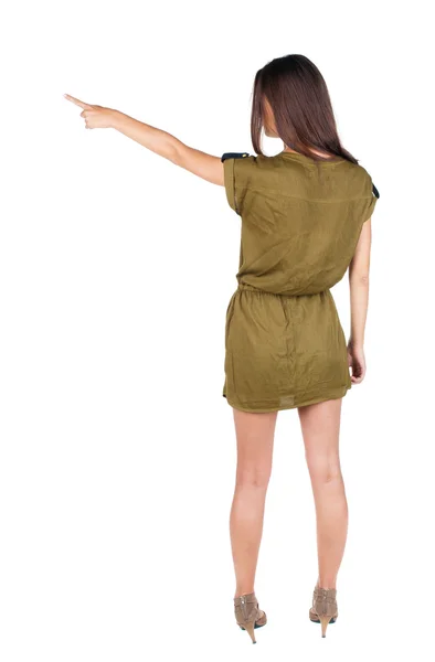 Back view of pointing woman. — Stock Photo, Image