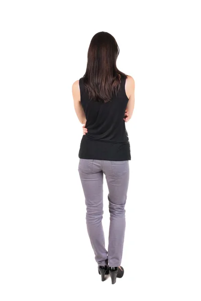 Vista posterior de la hermosa joven de pie. —  Fotos de Stock