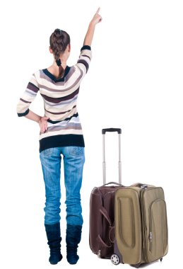 Genç Bayan duvara dönük suitcas ile seyahat..