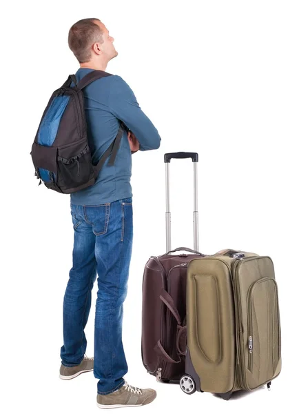 Back view of man with photographic backpack looking up — Stock Photo, Image