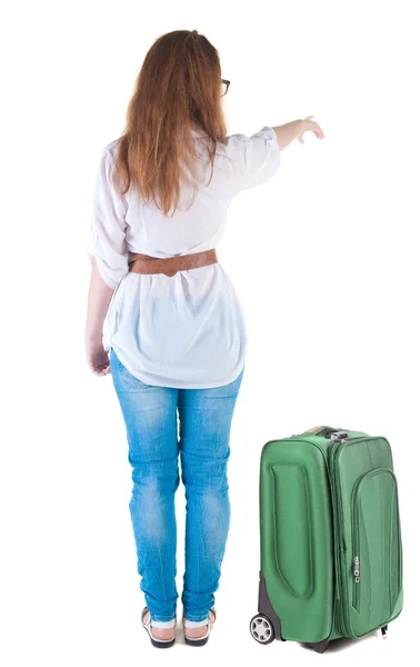Reisen junge Frau mit Suitcas Punkten an Wand. — Stockfoto
