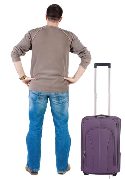 Путешествия молодой человек с чемоданом — стоковое фото