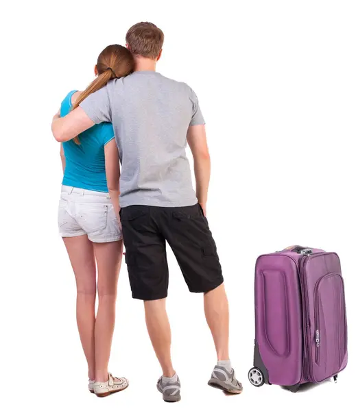 Back view of young traveling couple with suitcase — Stock Photo, Image