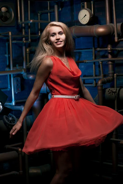 Blonde in a red dress — Stock Photo, Image