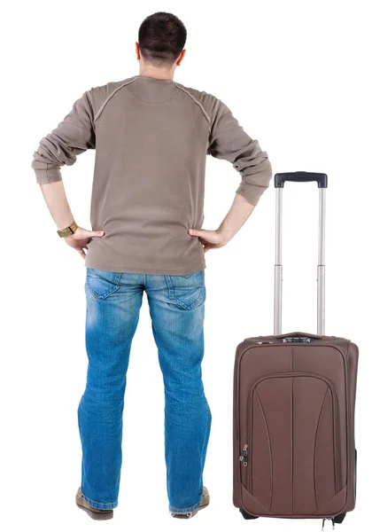 Traveling young man with suitcase – stockfoto