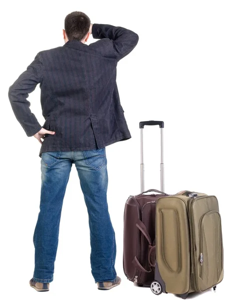 Olha jovem perito itinerante com suitcas — Fotografia de Stock
