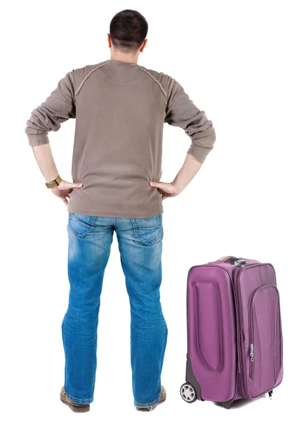 Giovane uomo con la valigia in viaggio — Foto Stock