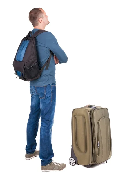 Rückansicht des Mannes mit fotografischen Rucksack nachschlagen — Stockfoto