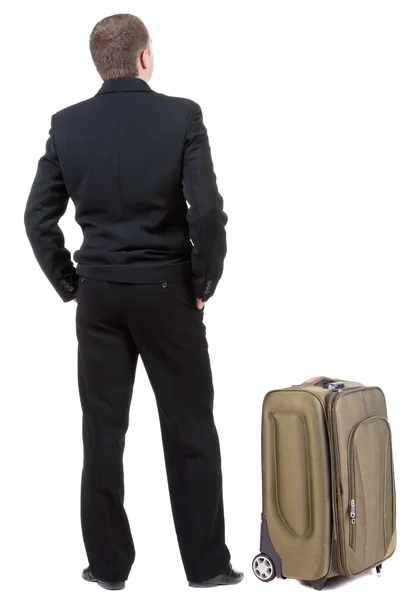 Man in black suit traveling with suitcas — Stock Photo, Image