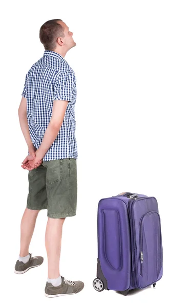 Young man traveling with suitcas - Stock-foto
