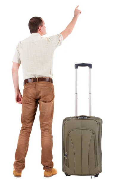 Pointing young men traveling with suitcas — Stock Photo, Image