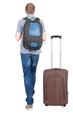 arkadan görünüşü ile bavul seyahat genç adam.
