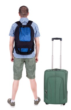 arkadan görünüşü ile bavul seyahat genç adam.