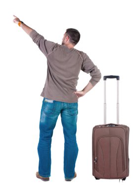 Arkadan görünüş-genç erkek ile bavul seyahat işaret.