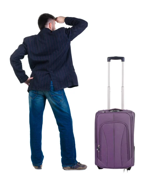 Young expert traveling with suitcase looks ahead. — Stock Photo, Image