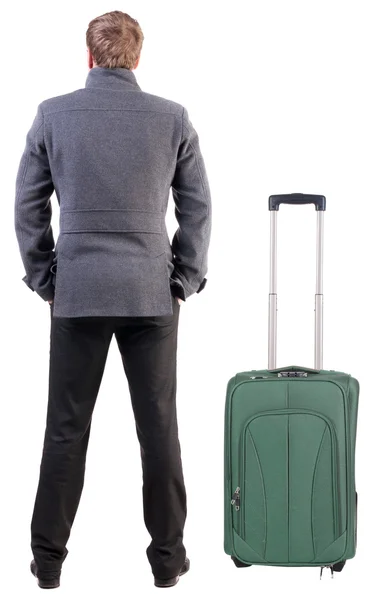 Back view of young man traveling with suitcase. — Stock Photo, Image