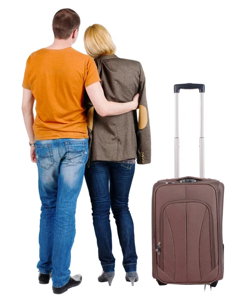 Back view of young couple traveling with suitcase. — Stock Photo, Image