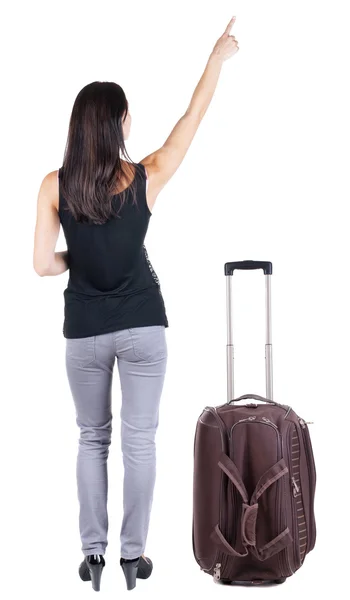 Arkadan görünüşü ile bavul seyahat genç esmer kadın — Stok fotoğraf