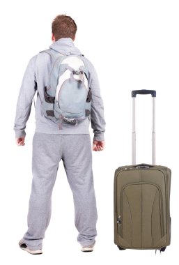 arkadan görünüşü ile bavul seyahat genç adam.