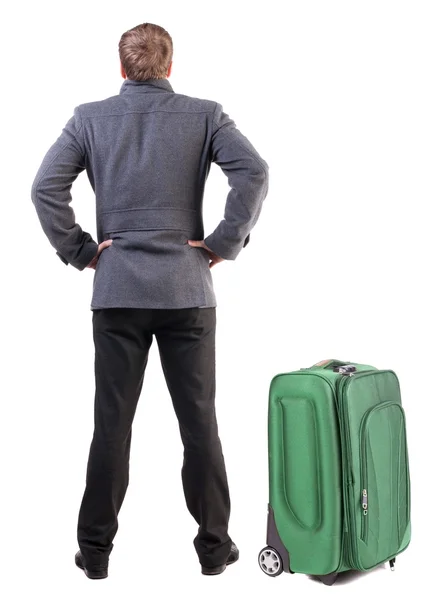 Back view of young man traveling with suitcase. — Stock Photo, Image