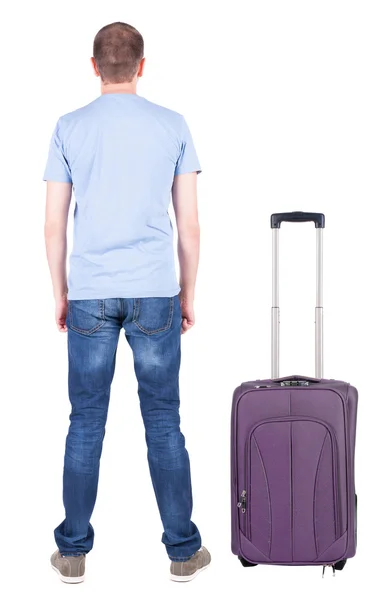 Vedere din spate a tânărului care călătorește cu valiza . — Fotografie, imagine de stoc