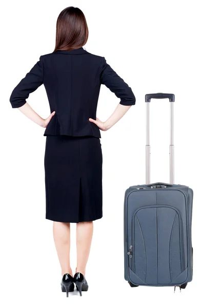 Back view of thoughtful business woman traveling with suitcase. — Stock Photo, Image