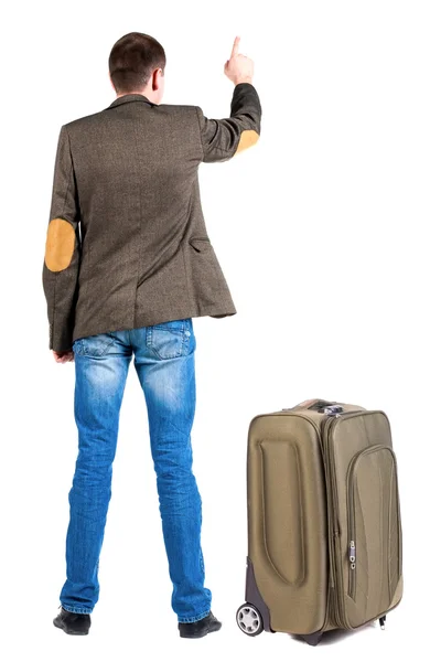 Vista dos apontando o homem de negócios na jaqueta viajar com mala traseira — Fotografia de Stock