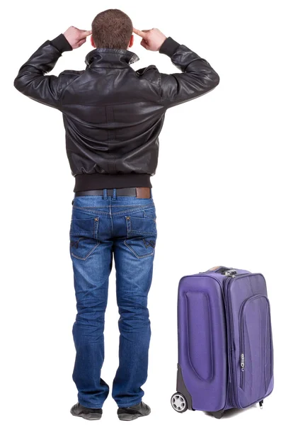 Back view of young man traveling with suitcase. — Stock Photo, Image