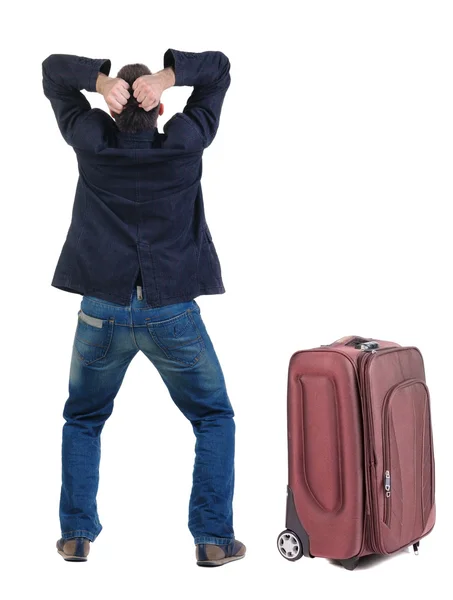 Jovem revoltado com a mala de viagem — Fotografia de Stock