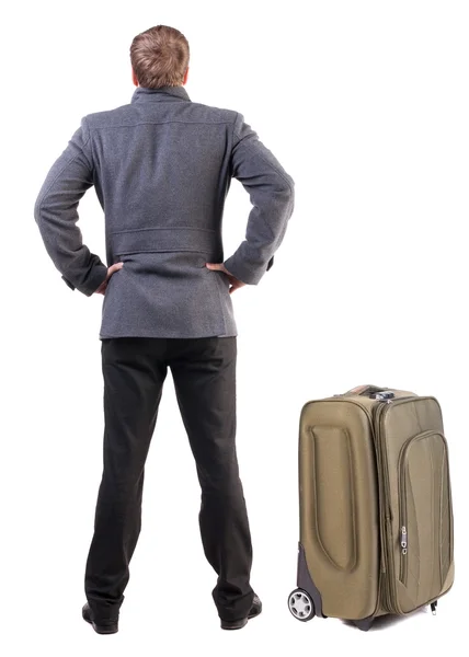 Vista posterior de joven viaja con maleta. — Foto de Stock