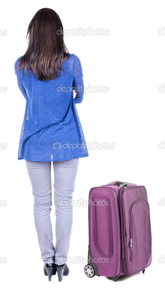 Back view of standing young beautiful brunette woman