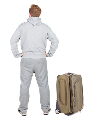 arkadan görünüşü ile bavul seyahat genç adam.